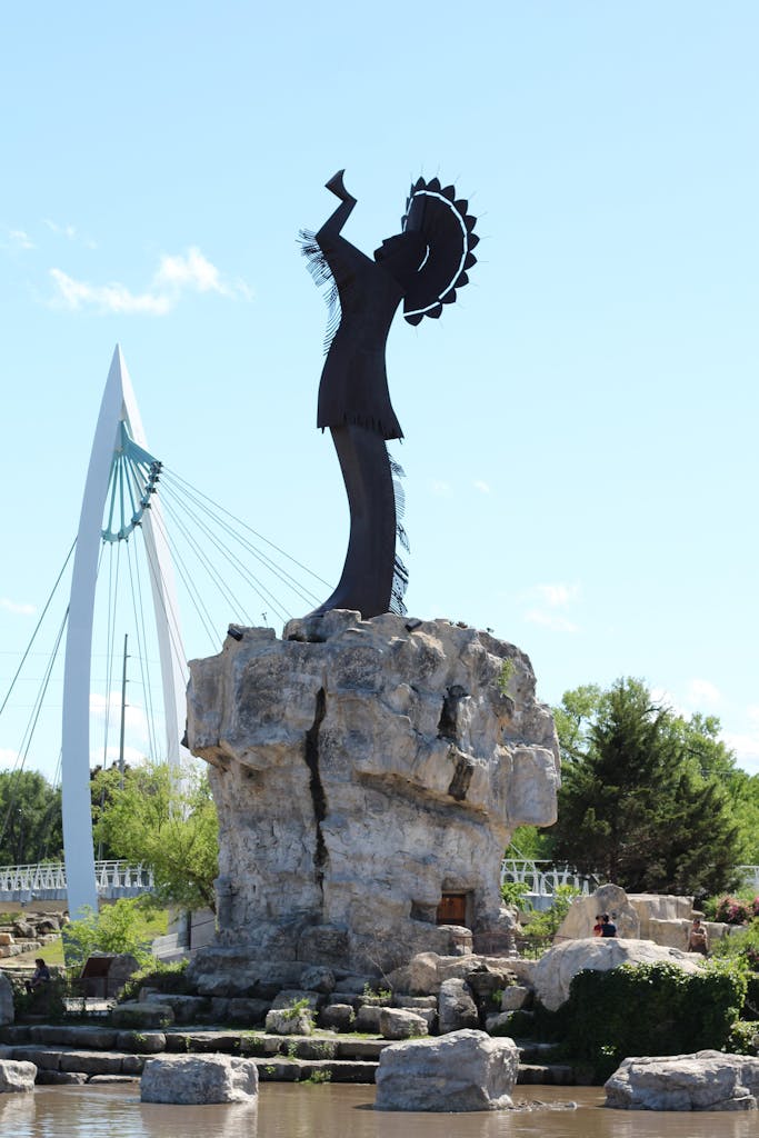 The iconic Keeper of the Plains statue against a clear blue sky in Wichita, KS.